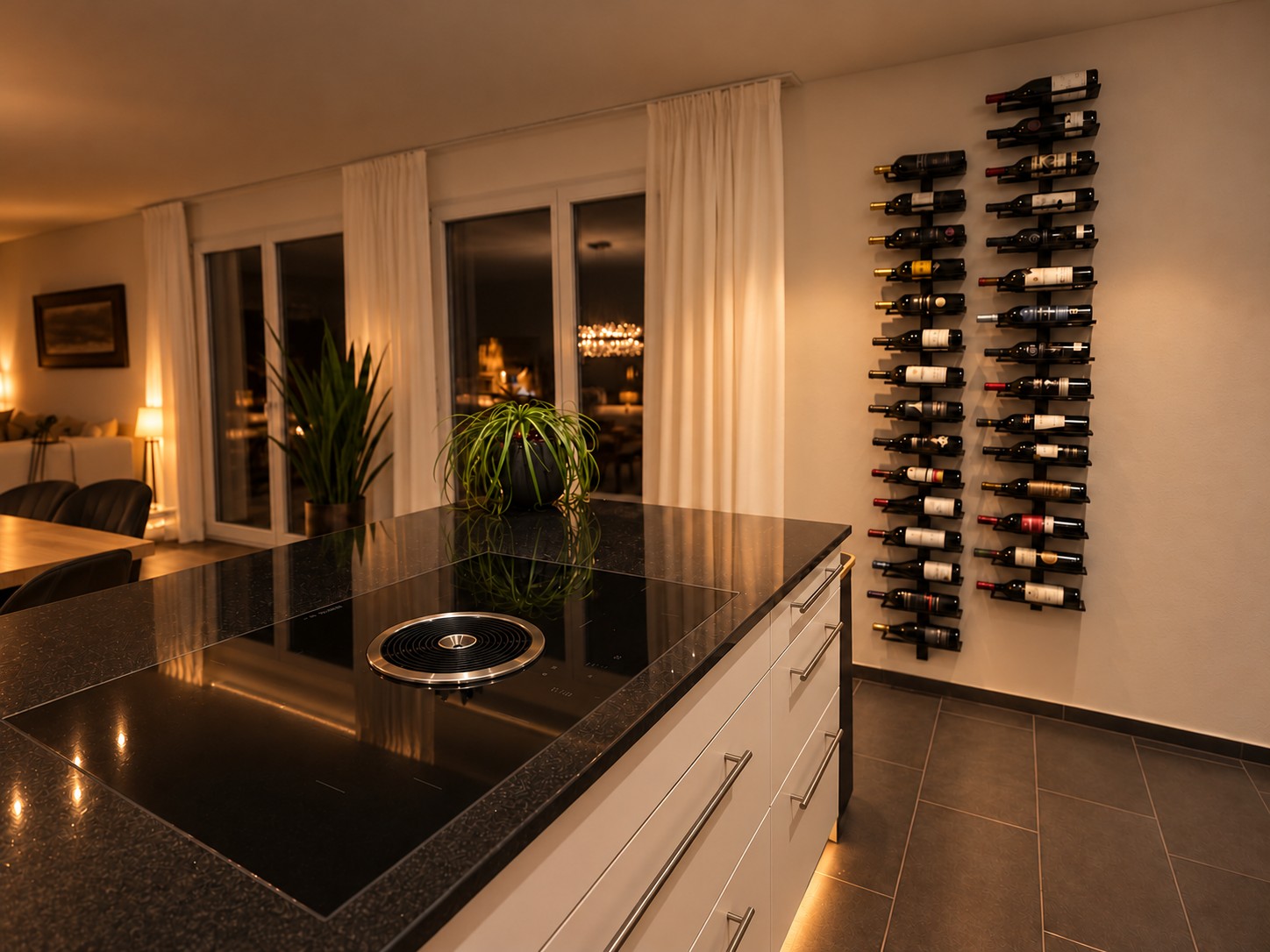 Kitchen with cooking island and wine racks in the evening